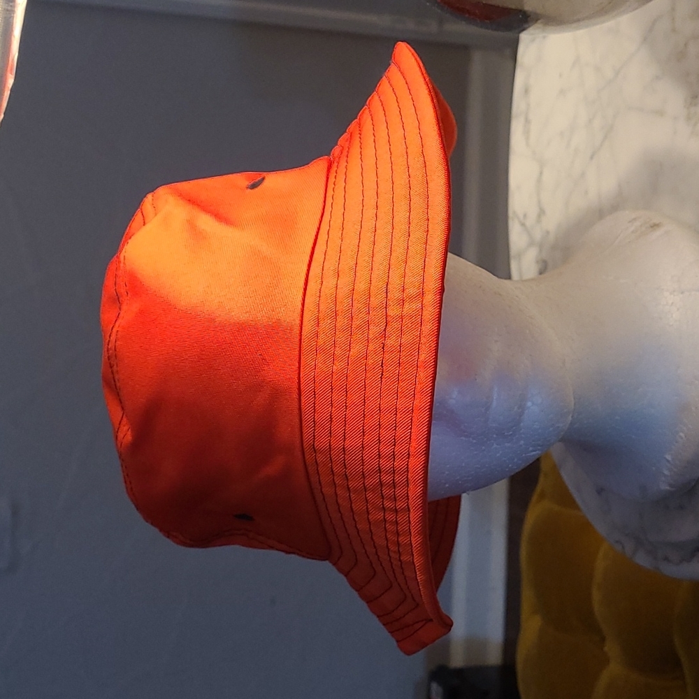 Red bucket hat with black stitches